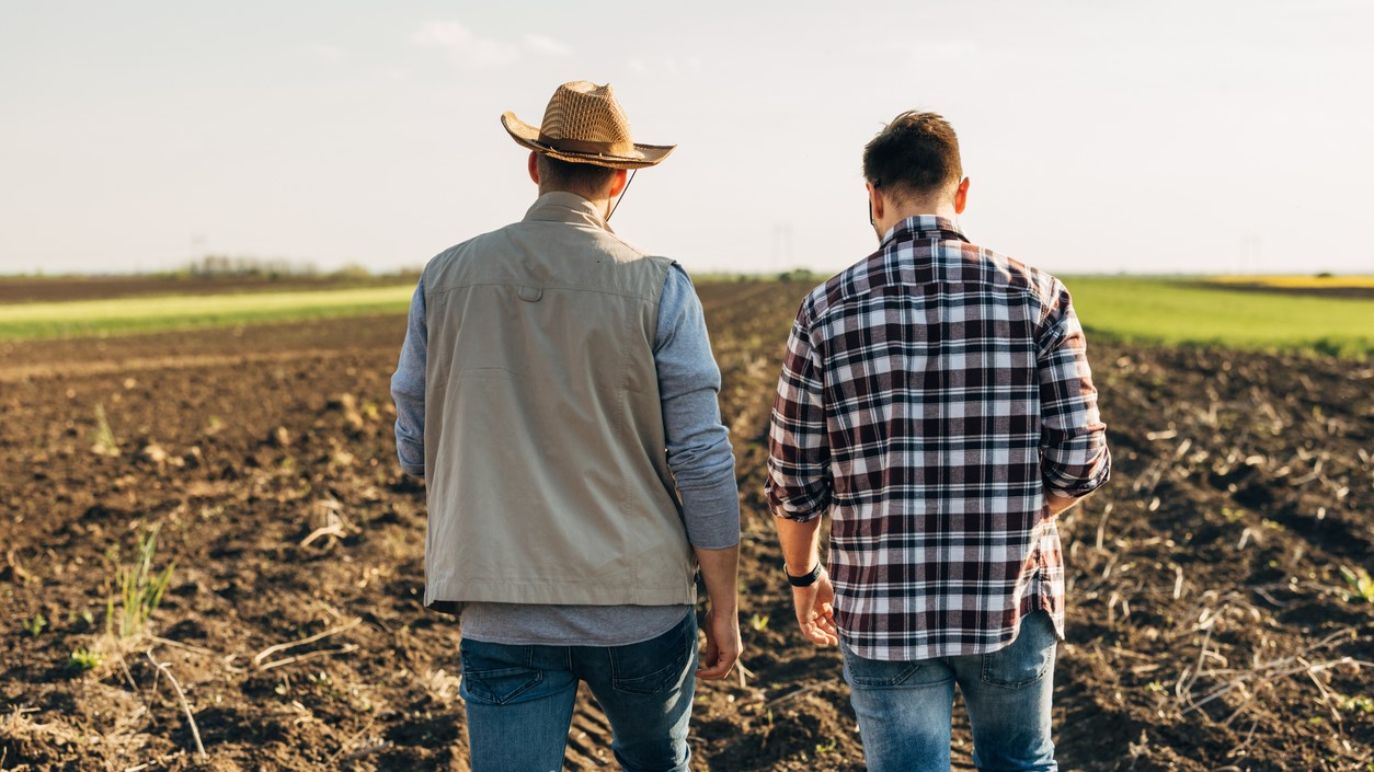 Farmers on field, Dejan_Dundjerski via iStock